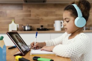 little girl online school with tablet